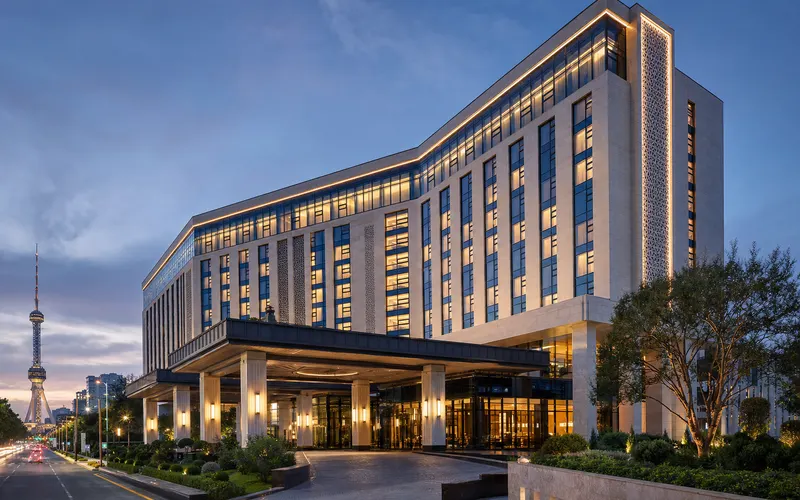AI-generated editorial dusk view of Hyatt Regency Tashkent in Tashkent, Uzbekistan