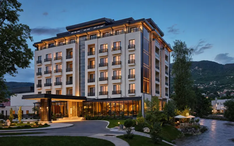 AI-generated editorial dusk view of Malak Regency Hotel in Sarajevo, Bosnia and Herzegovina