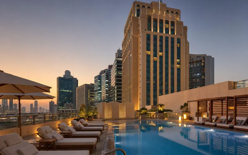 AI-generated editorial dusk view of Millennium Downtown in Abu Dhabi, UAE