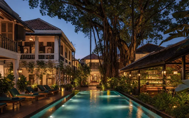 AI-generated editorial dusk view of The Raweekanlaya Bangkok Wellness Cuisine Resort in Bangkok, Thailand