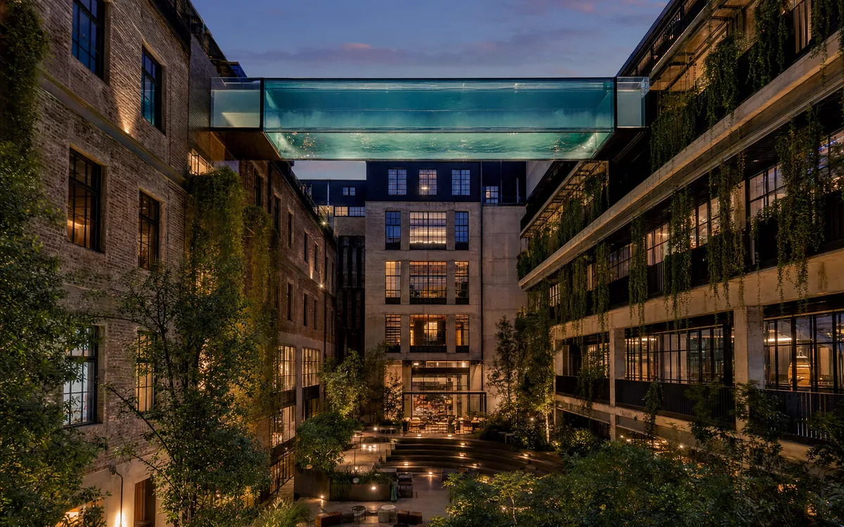 AI-generated editorial dusk view of Stamba Hotel in Tbilisi, Georgia