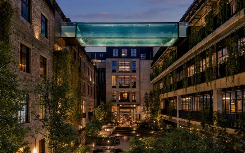 AI-generated editorial dusk view of Stamba Hotel in Tbilisi, Georgia